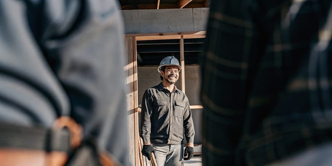 A confident small-business owner standing in their workplace